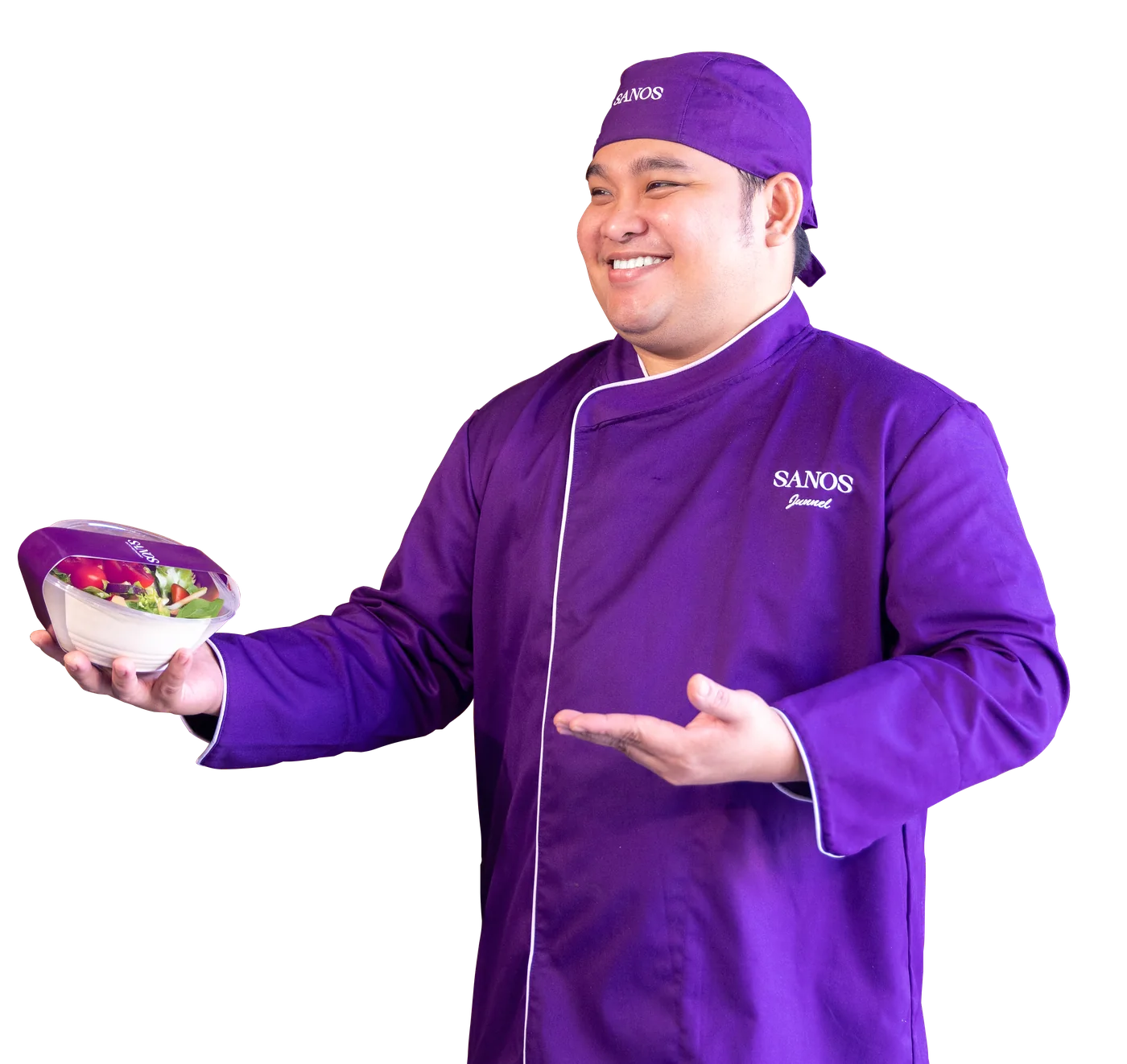 A Sanos chef holding a salad from the kitchen